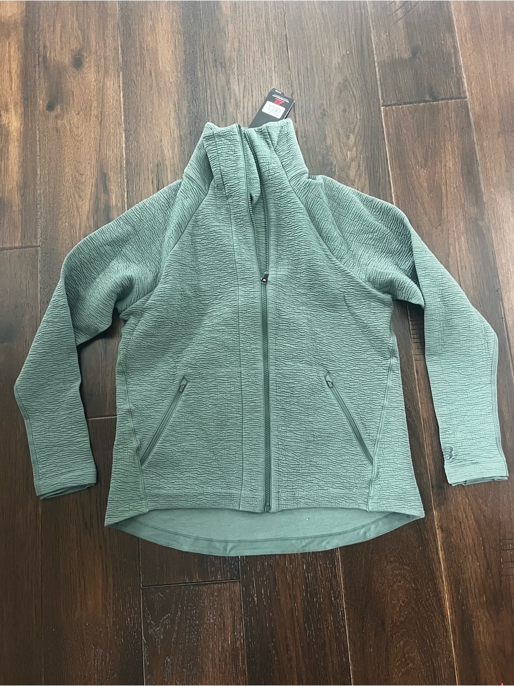 Captivate asym sage green jacket
